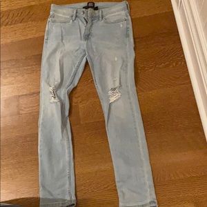 Light blue distressed slim jeans